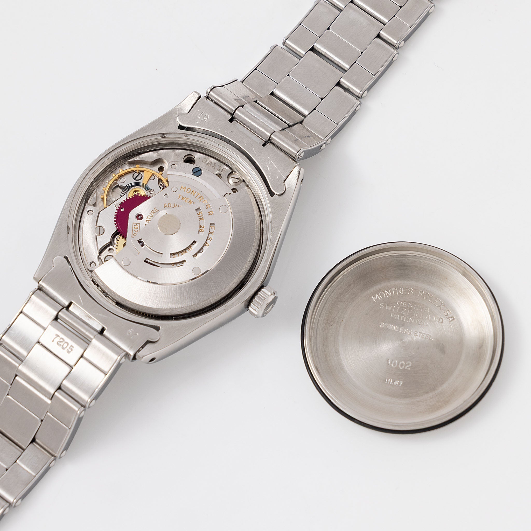 Rolex Oyster Perpetual 1002 "Burgundy Tropical Gilt Dial" with punched paper
