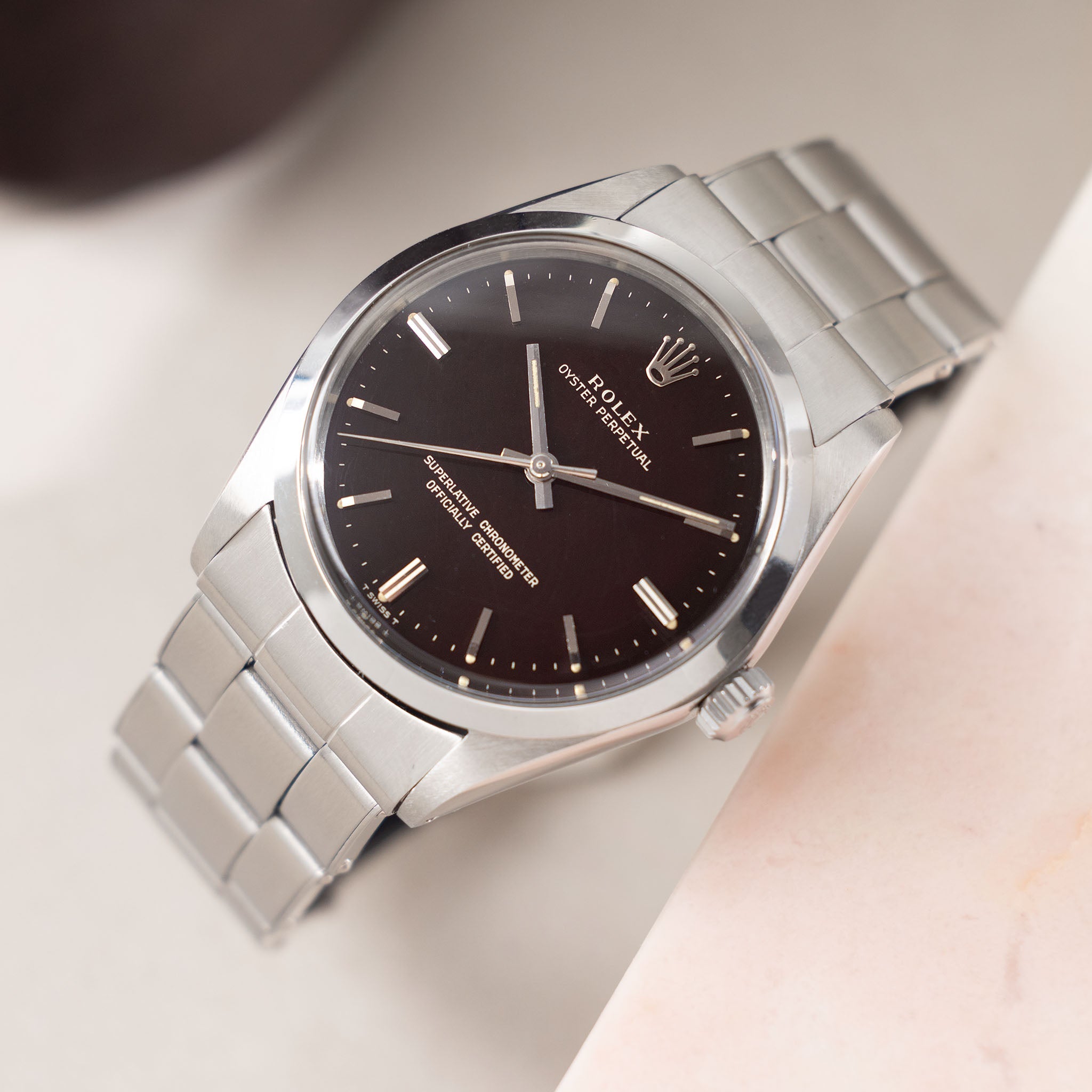 Rolex Oyster Perpetual 1002 "Burgundy Tropical Gilt Dial" with punched paper