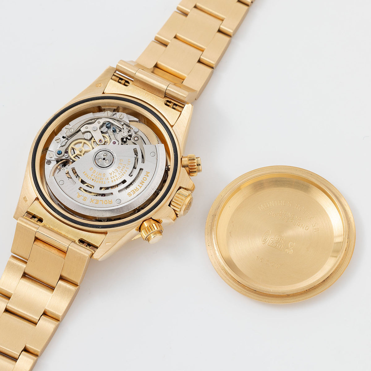 Rolex Cosmograph Daytona 16520 Black Floating Dial in 18k Yellow Gold with Original Guarantee Paper and Accessories