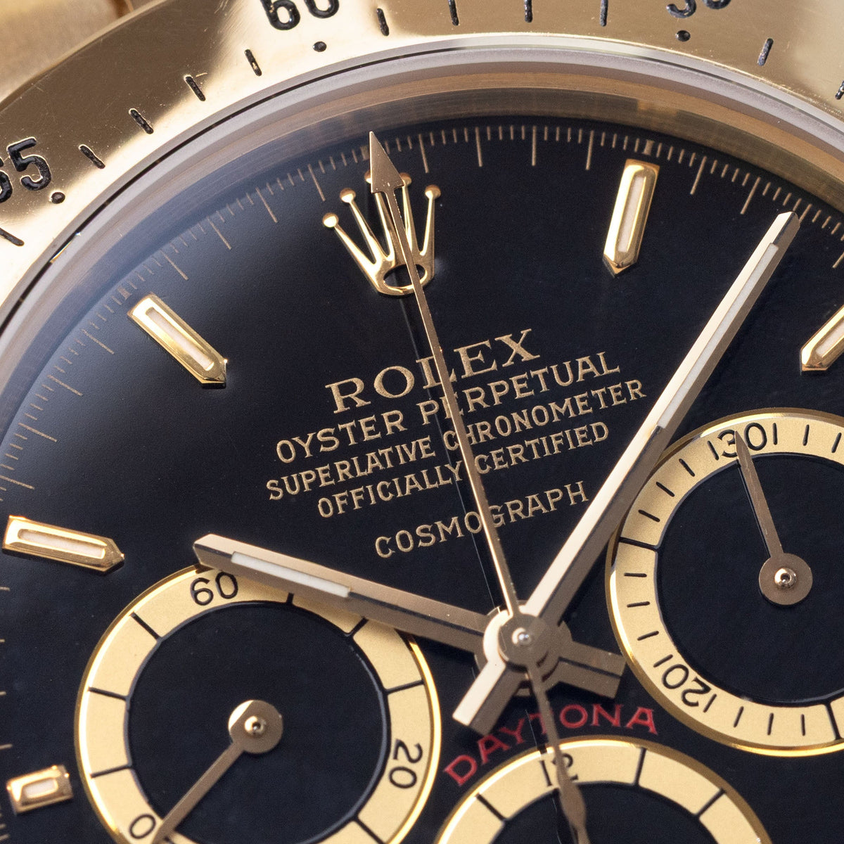 Rolex Cosmograph Daytona 16520 Black Floating Dial in 18k Yellow Gold with Original Guarantee Paper and Accessories