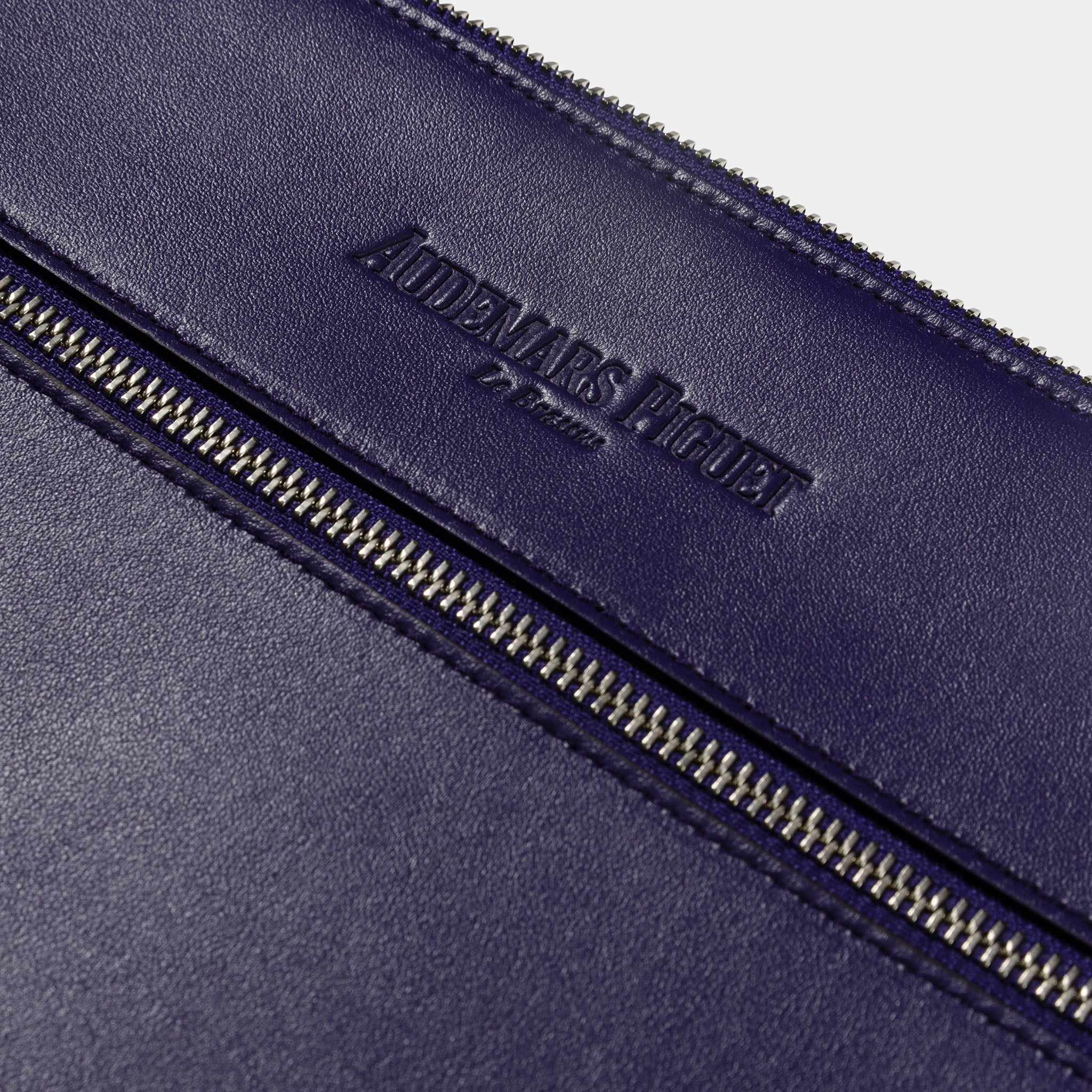 Audemars Piguet purple leather clutch