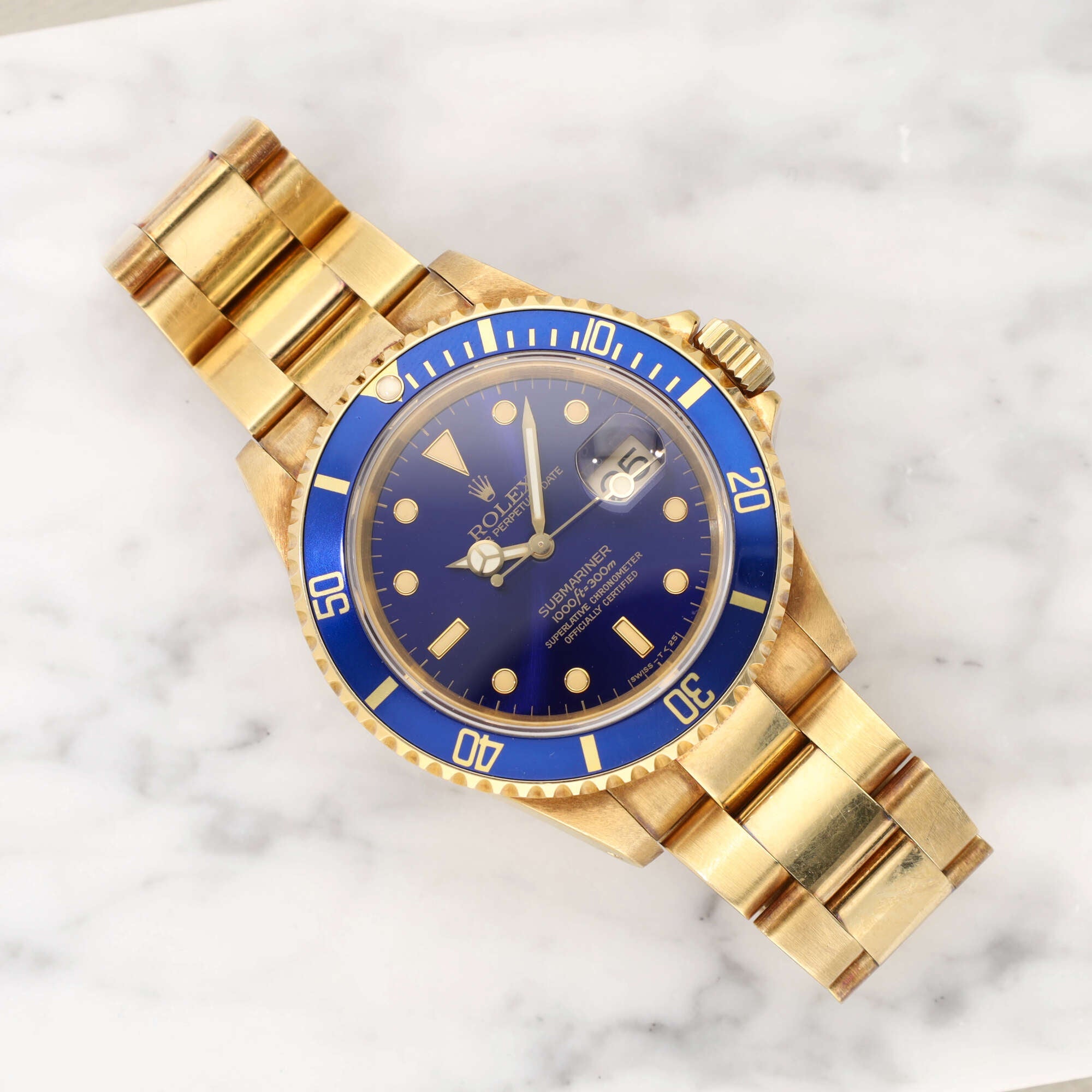 Rolex Submariner Date 16618 "Purple dial" in 18k yellow gold with papers - incoming