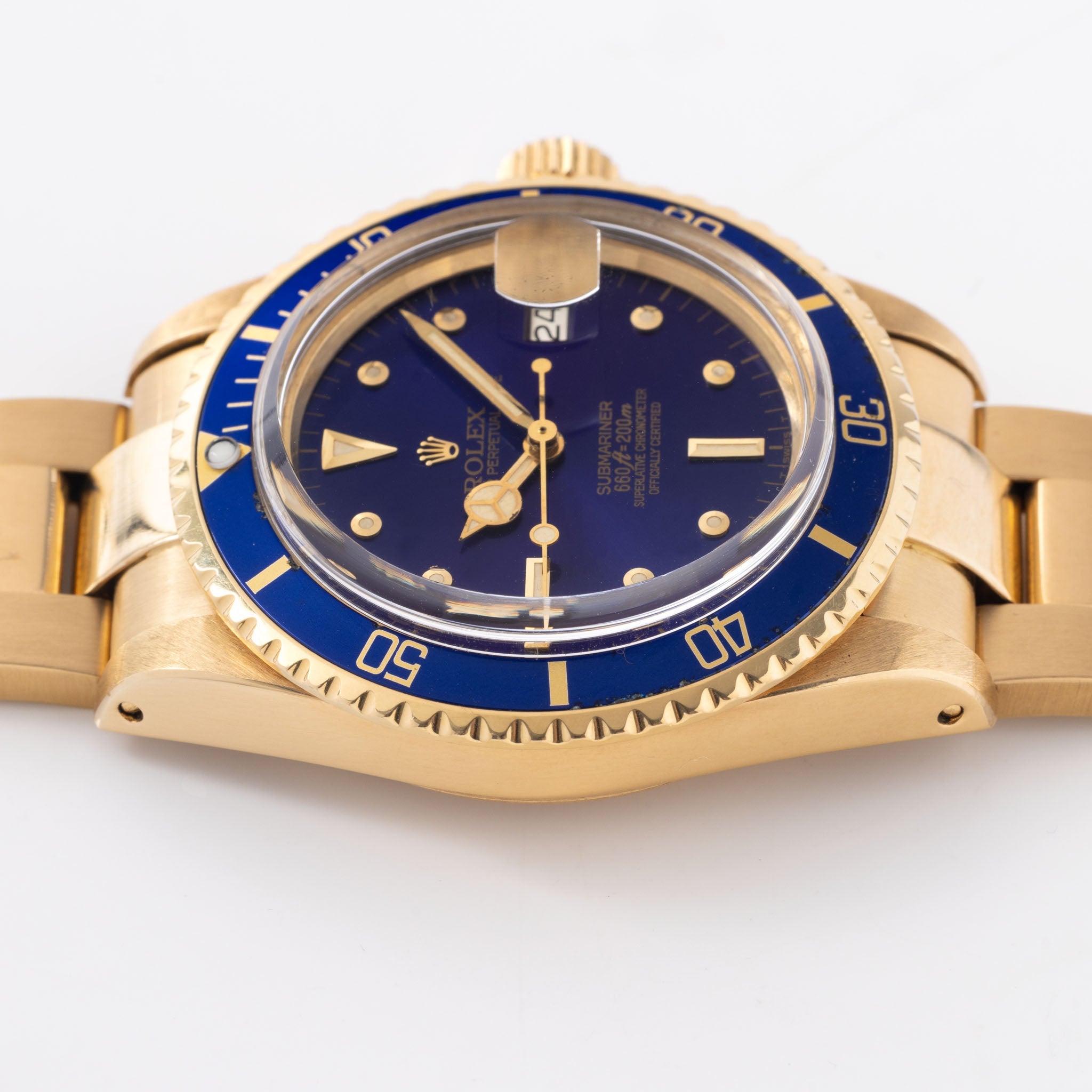 Rolex Submariner 1680/8 in 18k Yellow Gold with Blue "Nipple" Dial Turned Purple