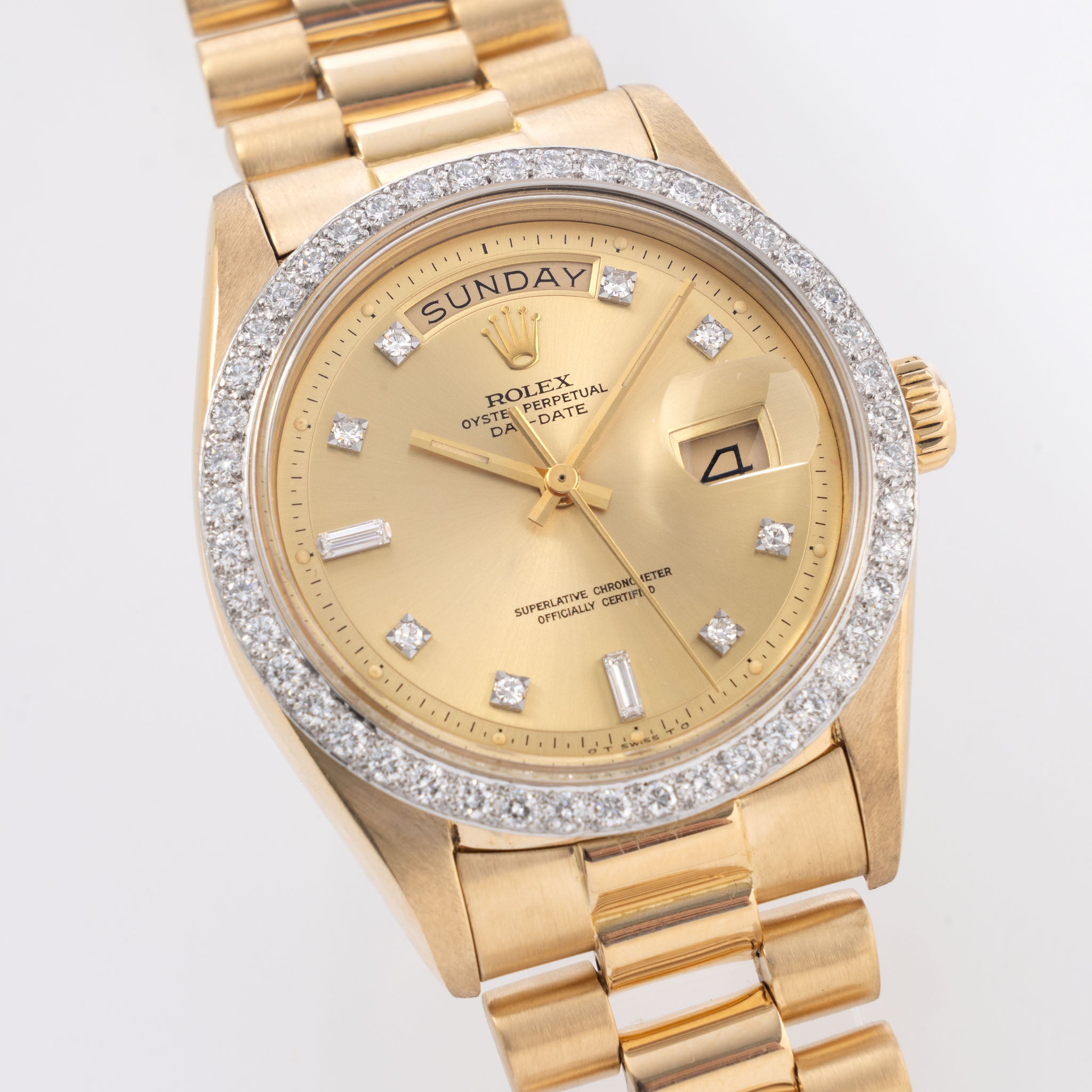 Rolex Day-Date Referenz 1804 mit Champagner Zifferblatt in 18 Karat Gelbgold und originalem Diamantenbesatz