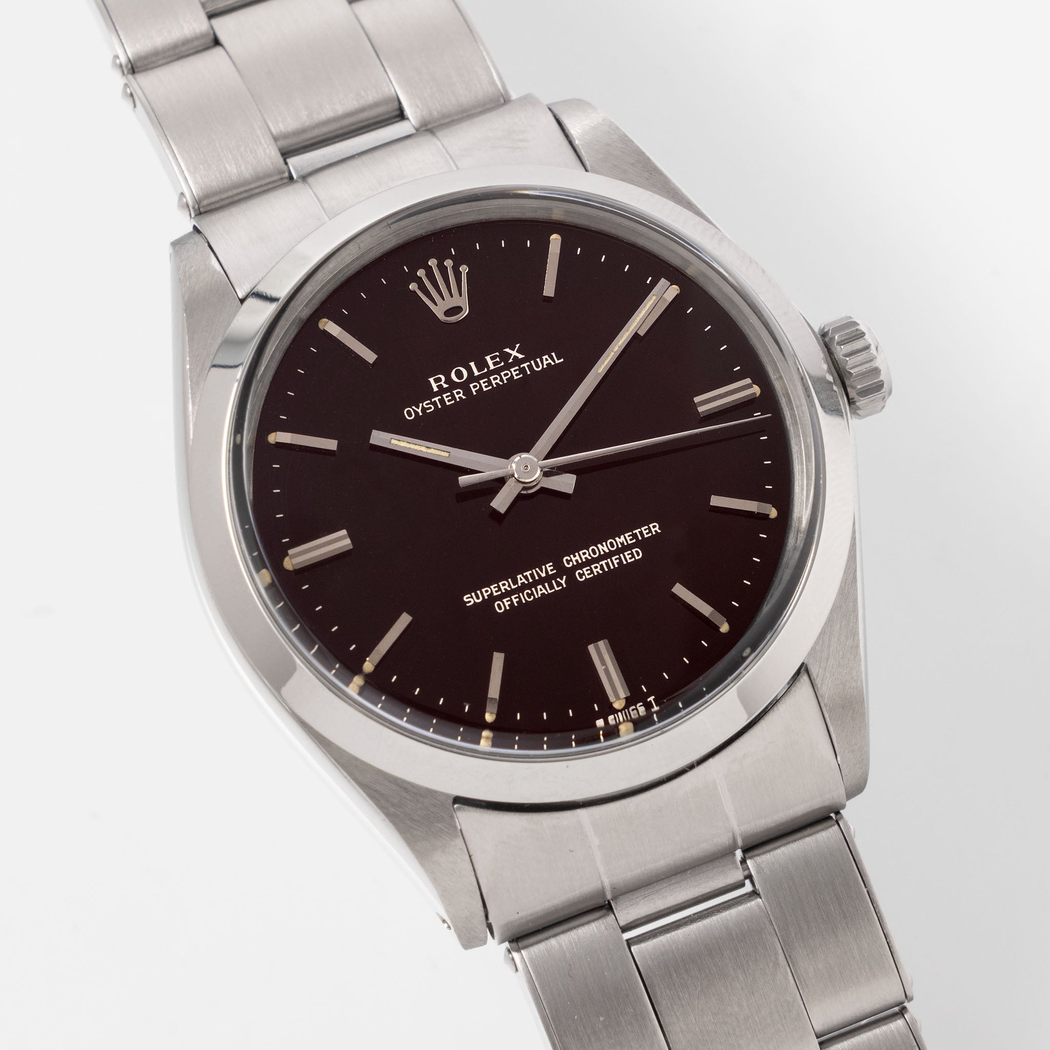 Rolex Oyster Perpetual 1002 "Burgundy Tropical Gilt Dial" with punched paper