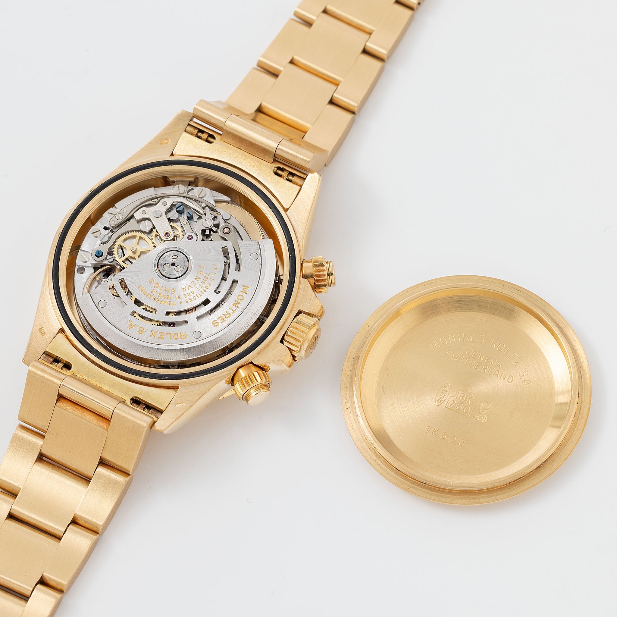 Rolex Cosmograph Daytona 16520 Black Floating Dial in 18k Yellow Gold with Original Guarantee Paper and Accessories
